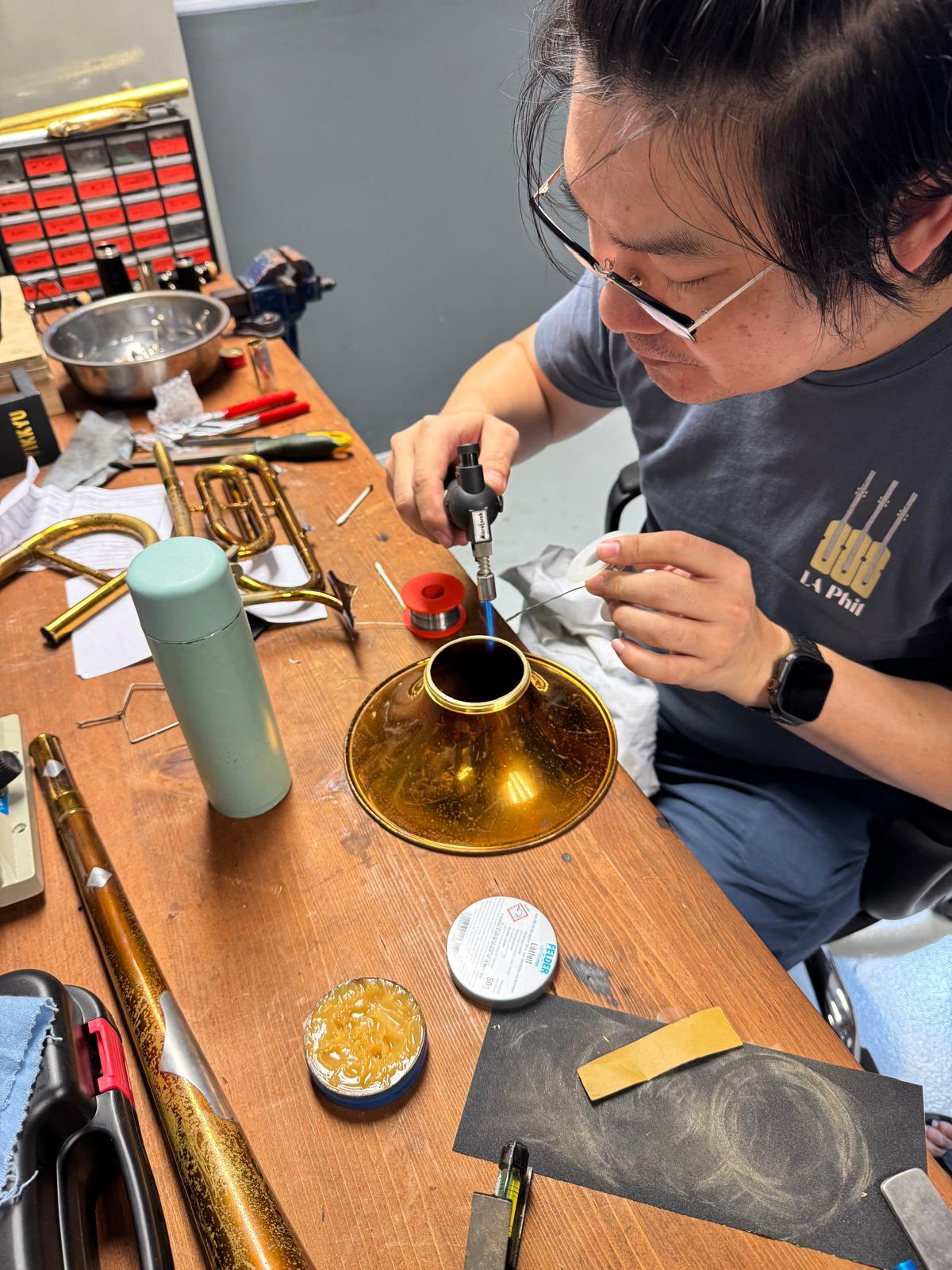 Soldering a brass bell during repair