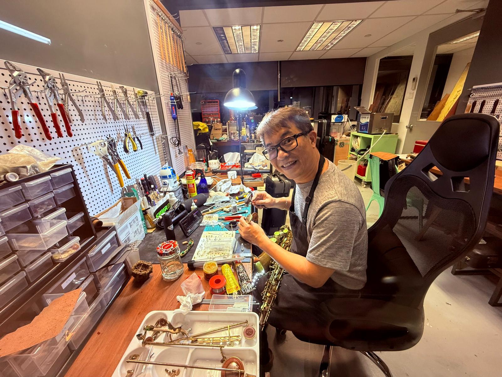 At the saxophone repair bench